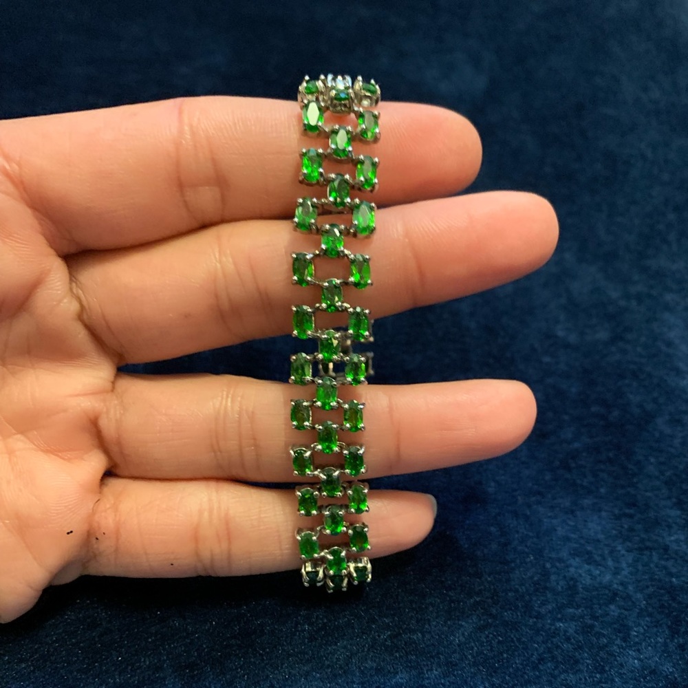 A beautiful silver bracelet with disopside gemstones.